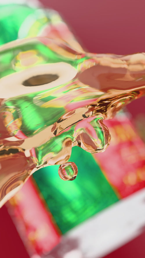 A video of Reed's Extra Ginger Beer with a can floating around with pieces of ginger on a red background.